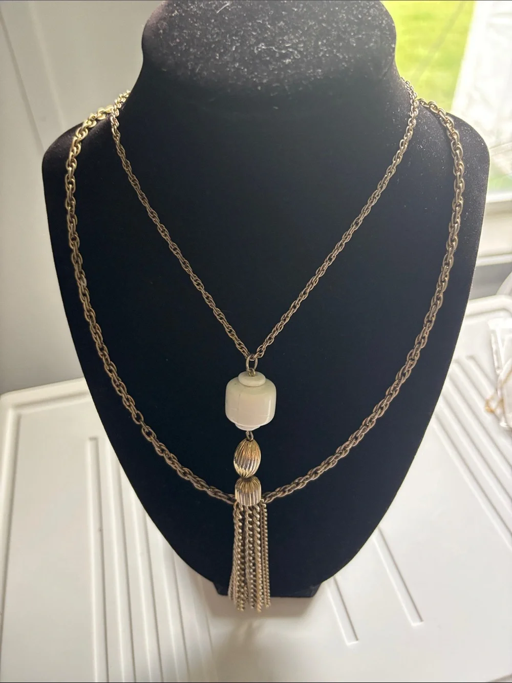 Gold-Tone Double Chain Necklace with White Bead and Tassel Pendant